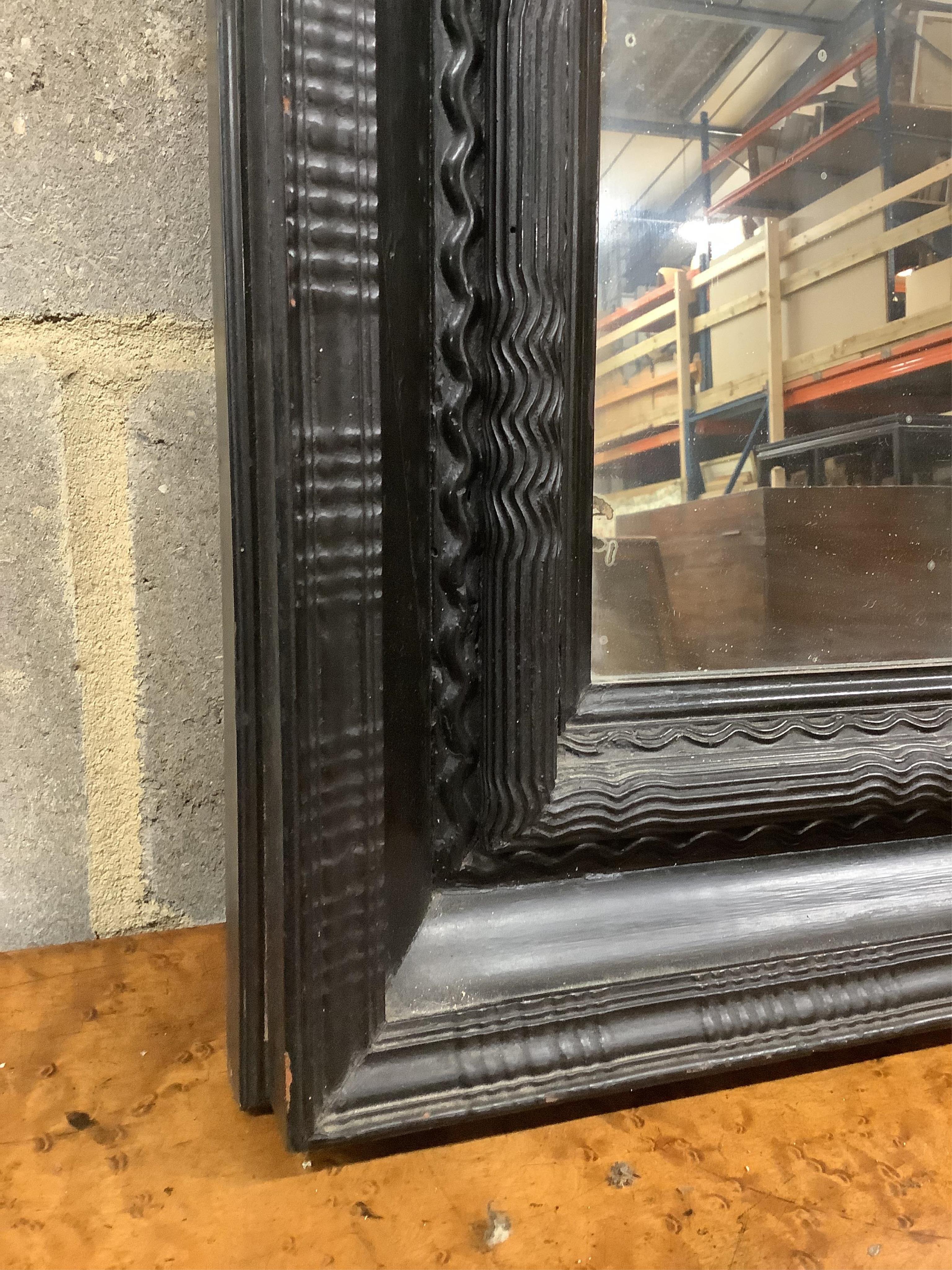 A Dutch ebonised ripple moulded frame, now a wall mirror, width 61cm, height 74cm. Condition - good